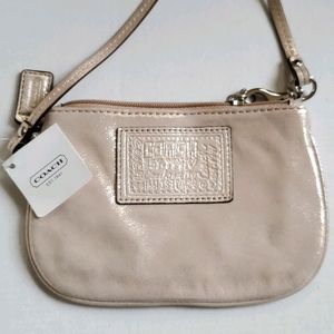 NWT Coach wristlet in champagne
